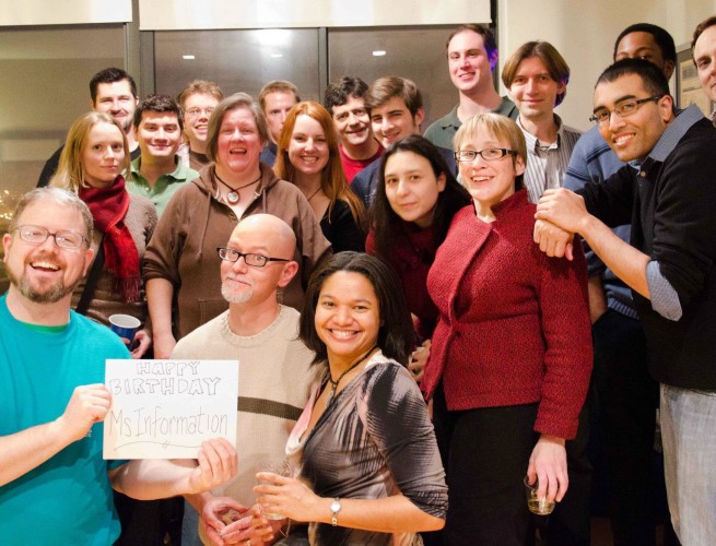 Large group of Chicago Skeptics holding a sign that says "HAPPY BIRTHDAY MS. INFORMATION!"