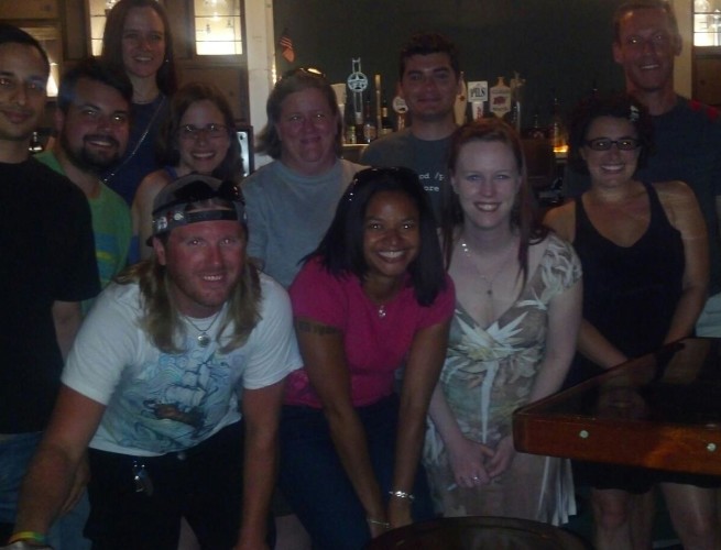 A dozen skeptics pose with Marian Call after her concert.