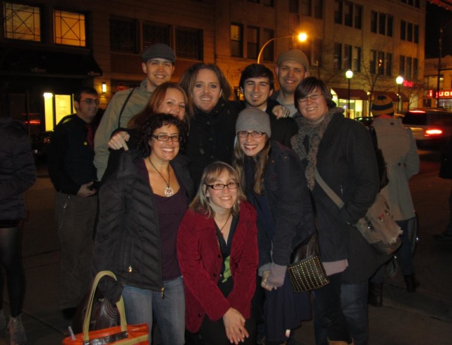 a group of skeptics pose with Tim Minchin outside after a concert.